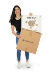 Woman posing with HOKU game set box
